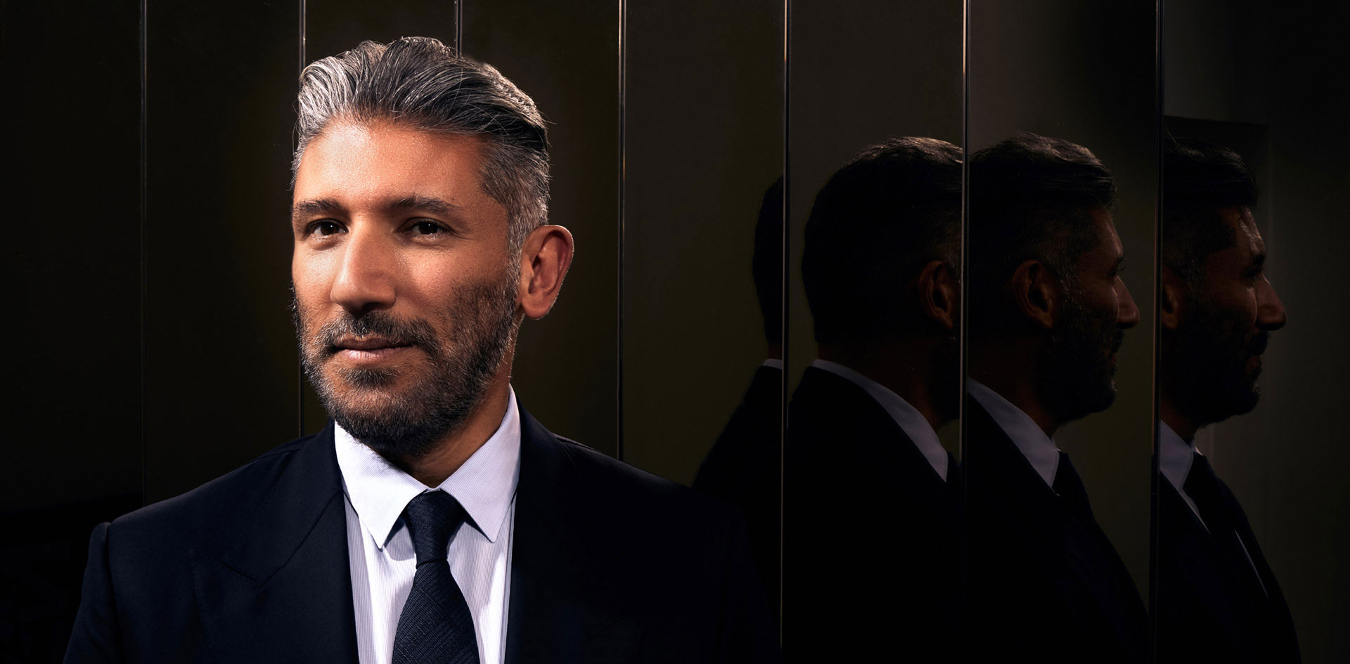 Dr. Soroudi in suit smiling