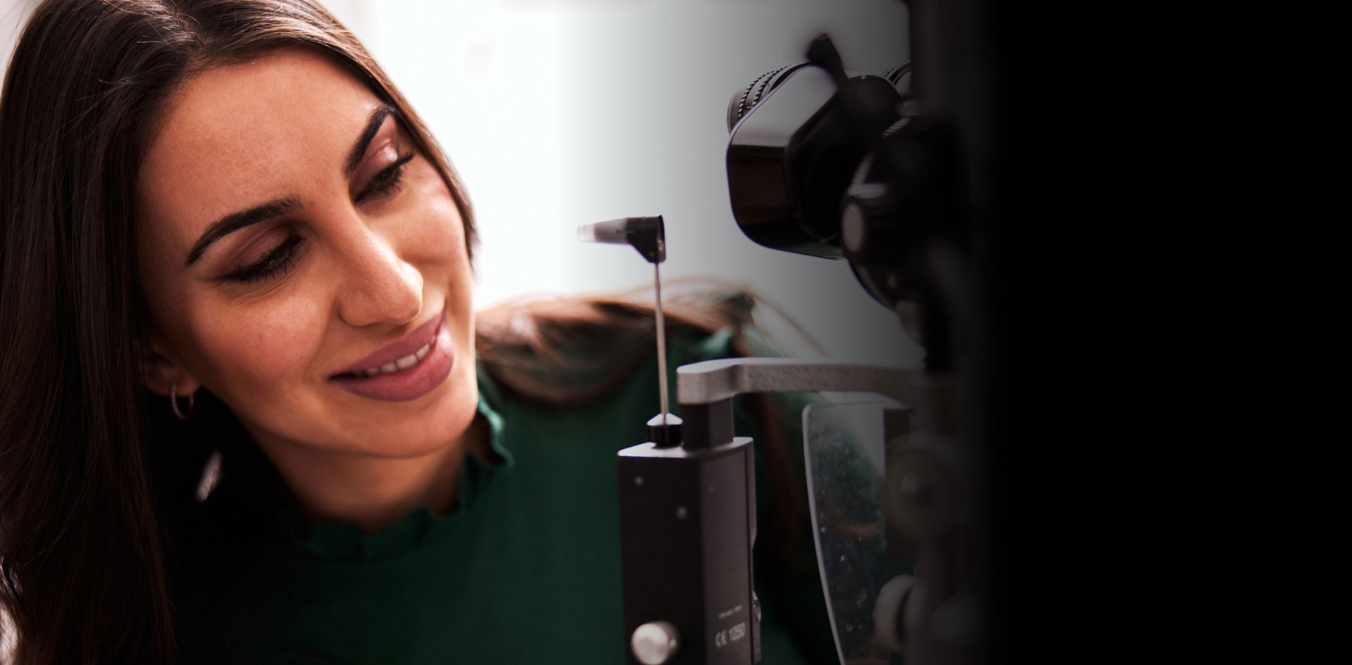Woman performing eye examination